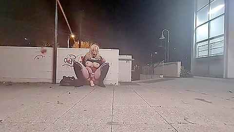Amateur blonde shemale rides a huge dildo on the street